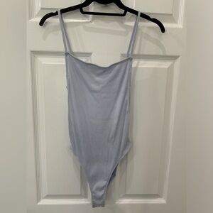 Out from under strappy bodysuit